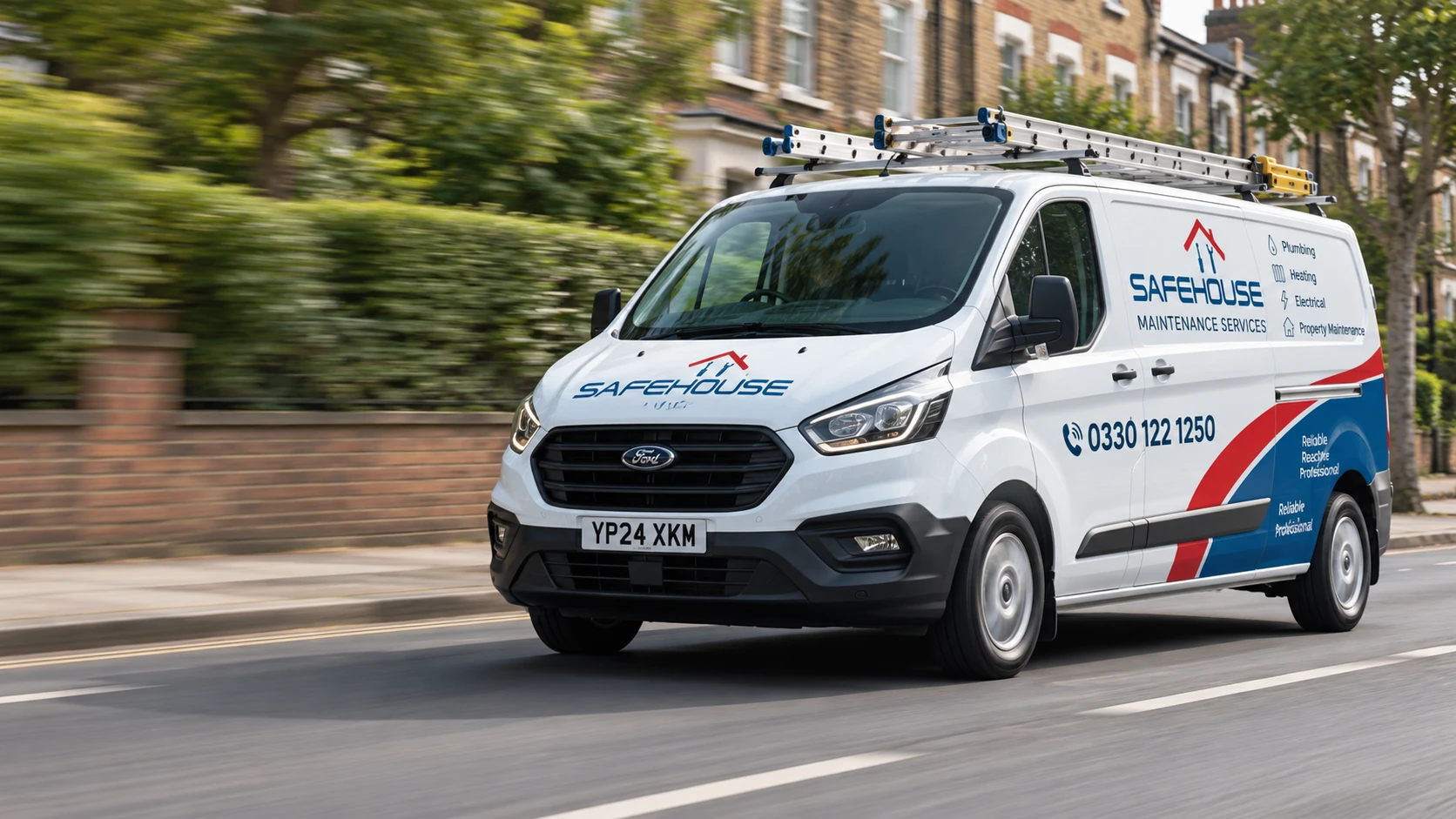 White Safehouse maintenance van with roof ladders travelling along a residential street.